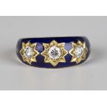 An 18ct gold, diamond and blue enamelled ring, star set with three circular cut diamonds against a