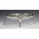 A German .800 silver mounted cut glass oval dish on four cabriole legs, length 34.5cm.Buyer’s