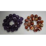 A single row necklace of twenty slightly graduated banded agate beads on a screw clasp, length 44cm,