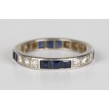 A diamond and sapphire full eternity ring, mounted with four rows of three circular cut diamonds