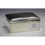 An Edwardian silver rectangular cigarette box, the hinged lid with engraved presentation inscription