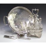 A late Victorian plated oval cruet stand, height 27.5cm, a .800 silver tea strainer and stand, an