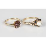 A 9ct gold ring, mounted with a central cultured pearl within a surround of six circular cut
