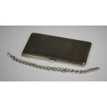 A George VI silver rectangular cigarette case with engine turned decoration, London 1947 by