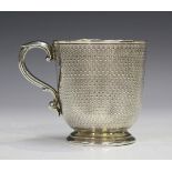 A Victorian silver christening cup, the 'U' shaped body with gilt interior and all-over engine