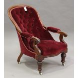 A Victorian mahogany showframe salon armchair, upholstered in claret velour, height 90cm, width