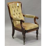 A mid-Victorian mahogany framed salon armchair, raised on 'Cope's Patent' brass caps and castors,