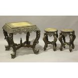 A late 19th century Burmese carved hardwood centre table with a pierced foliate frieze, height 66cm,