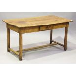 An 18th century French provincial fruitwood farmhouse table, the three-plank top above a single