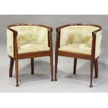 A pair of Edwardian Arts and Crafts style mahogany tub back chairs, the seat rails with chequer