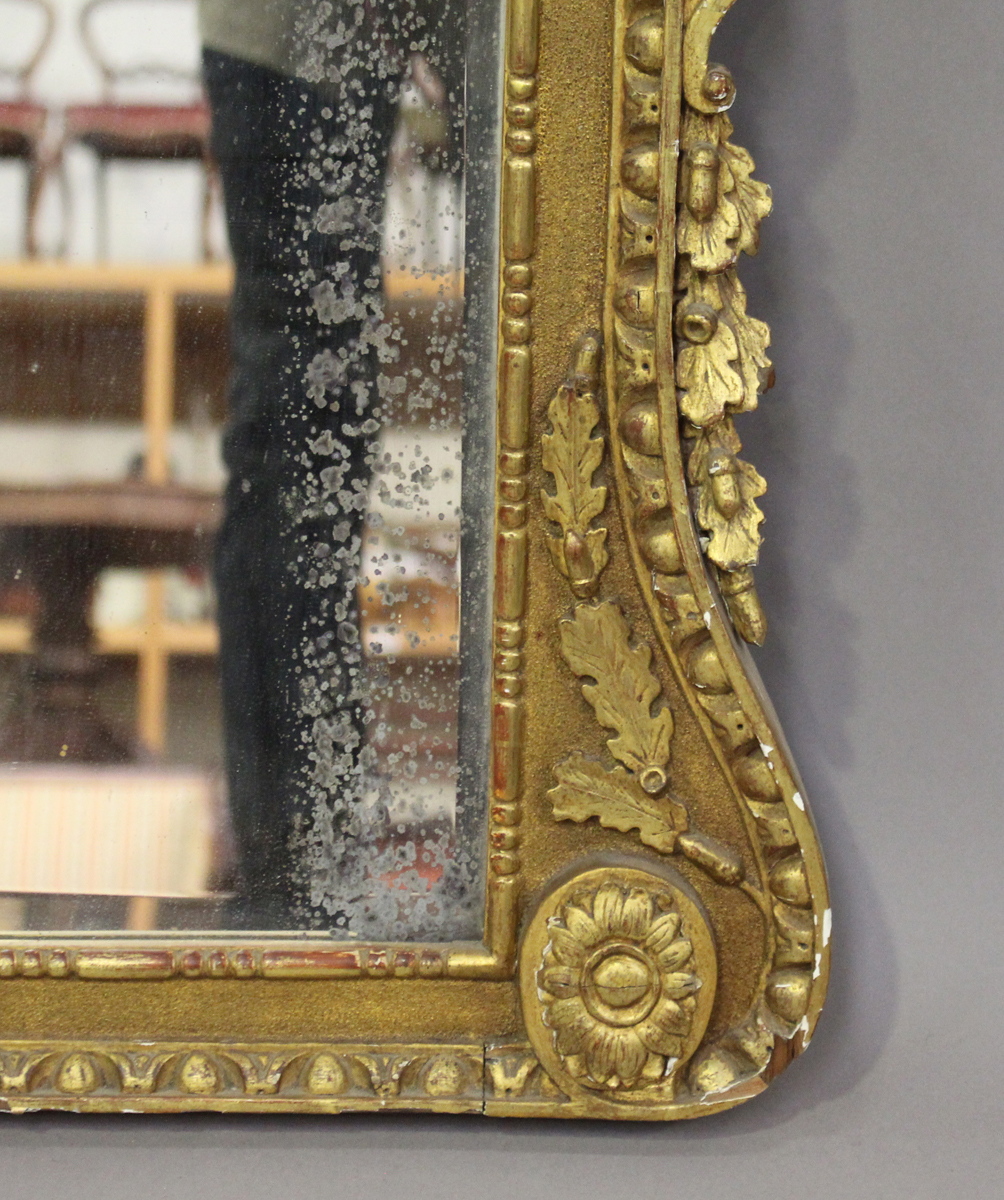 A 19th century George II style giltwood and gesso three-section overmantel mirror, the shaped - Image 3 of 3