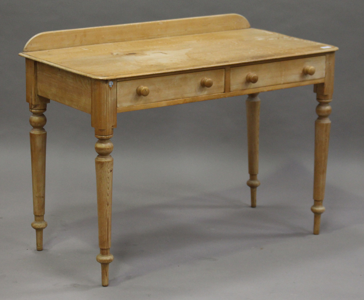 A Victorian pine side table, fitted with two drawers, height 78cm, width 106cm, depth 52cm.Buyer’s