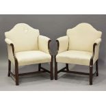 A pair of early 20th century mahogany framed hump back armchairs, on moulded block legs, height