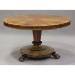 A mid-Victorian figured mahogany tip-top breakfast table, the radially-veneered top above a tapering