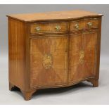 A 20th century George III style satinwood serpentine-fronted side cabinet with crossbanded and