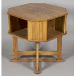 An early 20th century Arts and Crafts style oak canted square book table by Hypnos Cabinets,