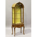 An early 20th century Queen Anne style walnut dome-topped narrow display cabinet by Maple & Co,