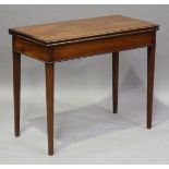 A George III mahogany fold-over card table, the top with chequer stringing, height 74cm, width 90cm,