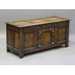 A mid/late 20th century Jacobean Revival oak panelled coffer, height 63cm, width 137cm, depth 54cm.