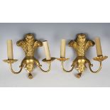 A set of six early/mid-20th century carved giltwood twin-light wall sconces with Prince of Wales