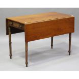 A Regency mahogany Pembroke table, the frieze with a single drawer, raised on ring turned legs,