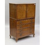 An early/mid-20th century burr walnut tallboy, fitted with a cupboard above a slide and four