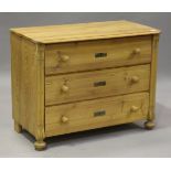 An early 20th century pine chest of three drawers, on bun feet, height 79cm, width 101cm, depth