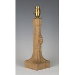 A Robert 'Mouseman' Thompson carved oak table lamp, the chamfered stem with typical mouse signature,