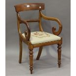 A Regency mahogany bar back elbow chair with a drop-in needlework seat, height 85cm, width 53cm.