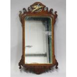 A 19th century George III style mahogany fretwork framed wall mirror with carved and gilded