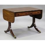 A Regency mahogany sofa table with rosewood crossbanding and boxwood stringing, fitted with two