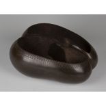 An early 20th century coco-de-mer nut, carved as a two-section bowl with central handle, length