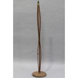 A mid-20th century teak and brass mounted lamp standard, height 158cm.Buyer’s Premium 29.4% (