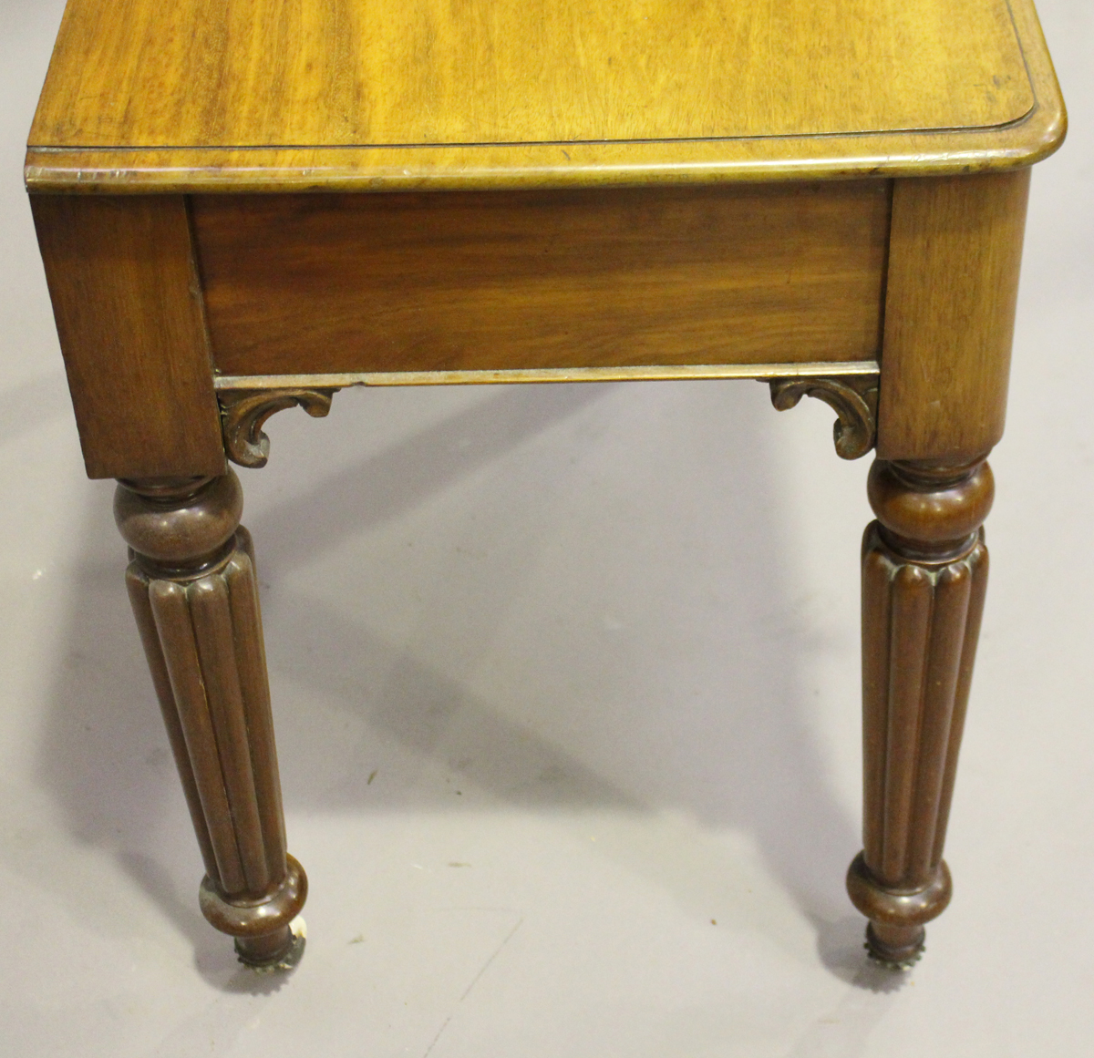 A Victorian mahogany side table, fitted with two frieze drawers, on reeded tapering legs and china - Image 2 of 3