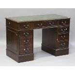 A late 20th century reproduction mahogany twin pedestal desk, the top inset with leather, height