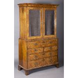 A George I walnut secrétaire cabinet, in the manner of William Old and John Ody, the cavetto moulded