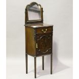 An Edwardian mahogany dressing cabinet with blind fretwork and foliate carved decoration, height