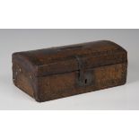 A 19th century Tudor Revival tooled leather domed-top box with handcrafted ironwork and paper-