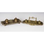 A late Victorian Baroque Revival cast brass inkstand, width 35cm, together with another similar