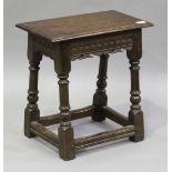 A 20th century Charles II style oak joint stool, the carved frieze on turned and block legs,