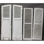 Two pair of early 20th century white painted French louvre shutter doors, comprising an arched pair,