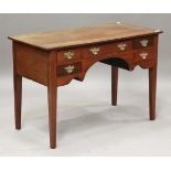 A 19th century mahogany kneehole writing table, fitted with an arrangement of five drawers, on