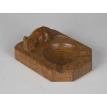 A Robert 'Mouseman' Thompson carved oak ashtray, the top with typical mouse signature, length 10.