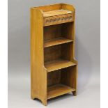An early 20th century pale oak narrow dwarf open bookcase, fitted with a single drawer, height 86cm,