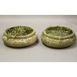 A pair of 20th century terracotta circular garden planters of low ribbed form, height 21cm, diameter