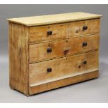 A 19th century pine chest of two short and two long drawers, height 88cm, width 127cm, depth 45cm.