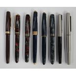 A quantity of fountain and roller ball pens, including four Burnham fountain pens and various Parker