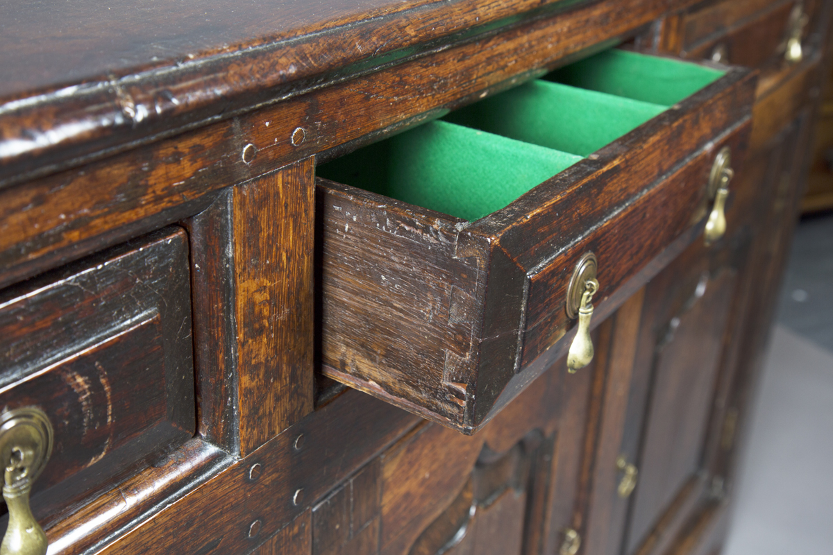 A mid-18th century provincial oak dresser base, fitted with three drawers above arched panel - Image 2 of 4