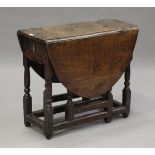 A small early 18th century oak oval gateleg table, fitted with a single drawer, height 65.5cm,