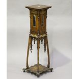 An early 20th century Arts and Crafts oak and softwood display pedestal, the sides with applied